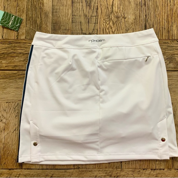 Brand new white Inphorm tennis skirt with pockets. Navy stripes down each side. - Picture 2 of 4